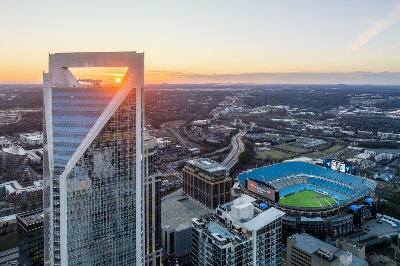 A view of the skyline of charlotte, nc at sunset